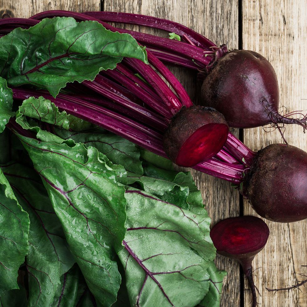 fresh organic beetroot over wooden background