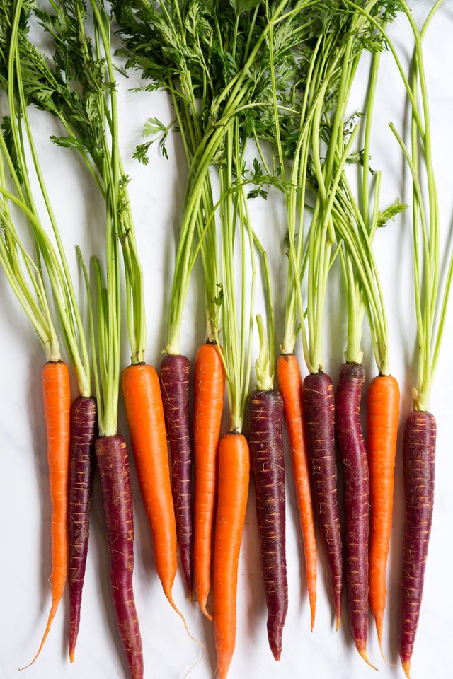fresh organic yellow and purple carrots