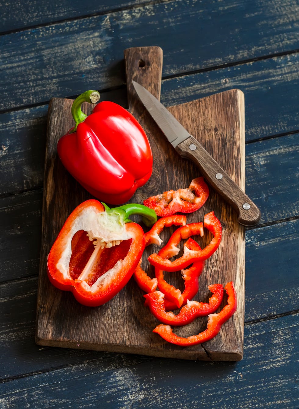 fresh red sweet pepper on a wooden rustic board