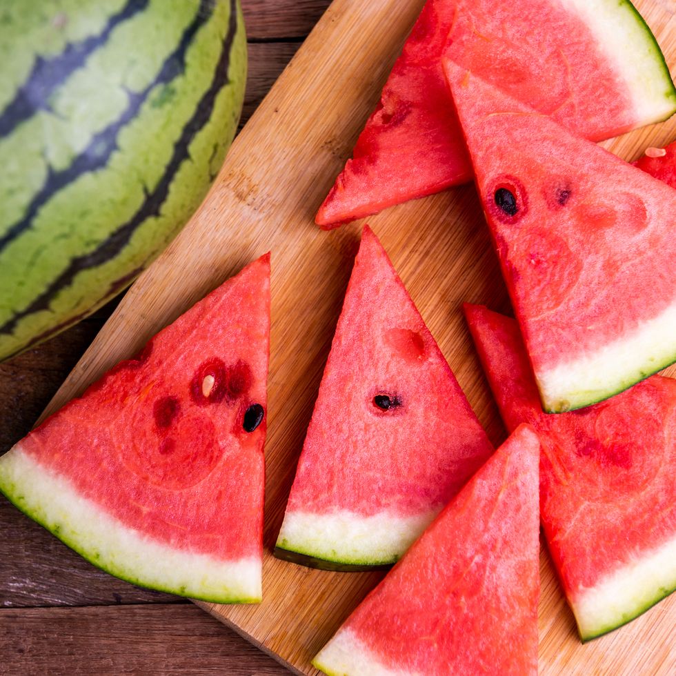 fresh ripe watermelon slices on wooden table