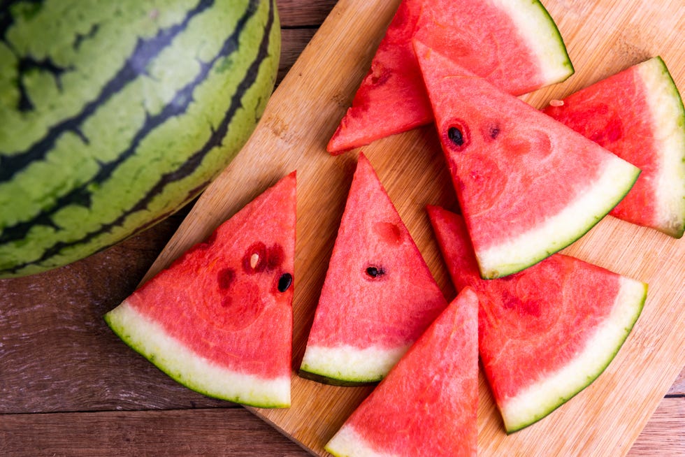 fresh ripe watermelon slices on wooden table