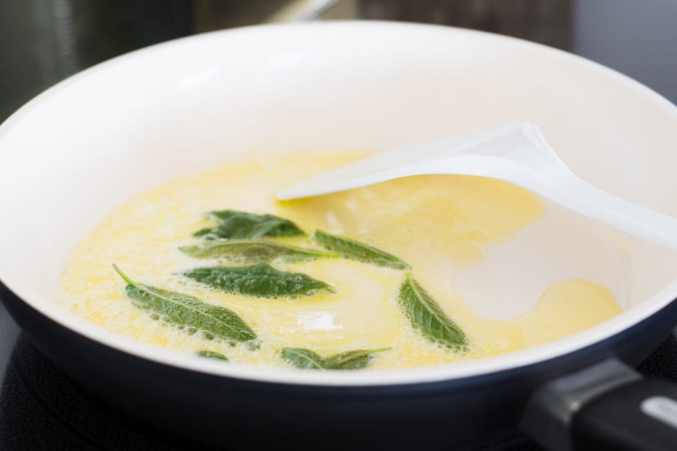 fresh sage leaves being fried in butter