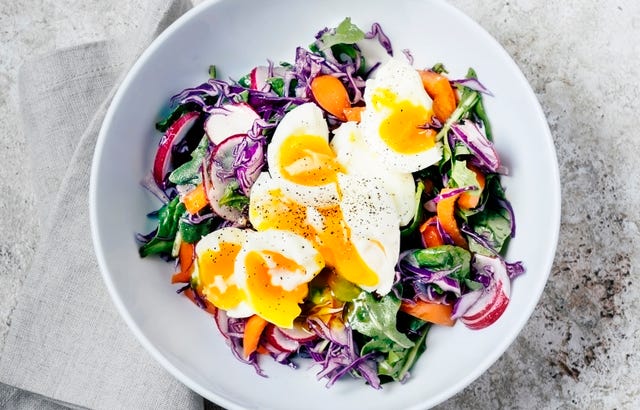 Fresh salad with soft boiled eggs