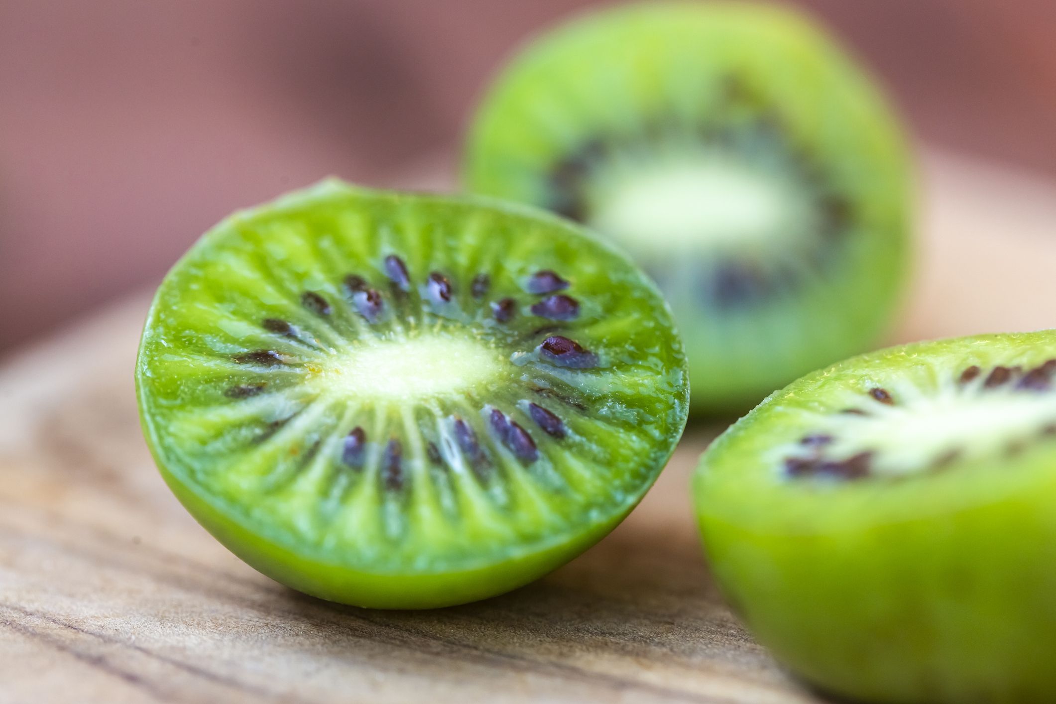 https://hips.hearstapps.com/hmg-prod/images/fresh-sliced-mini-kiwis-royalty-free-image-1690215764.jpg