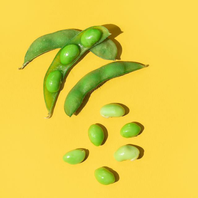 fresh soybeans edamame on a yellow colored background