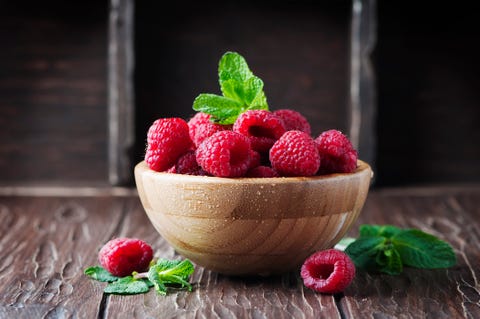 fresh sweet raspberry on the wooden table