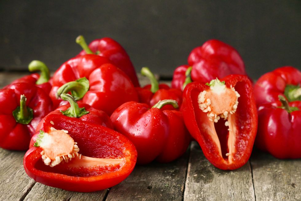 fresh sweet red pepper on old wooden background