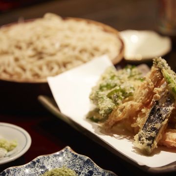 freshly made vegetable tempura accompanied by soba noodles