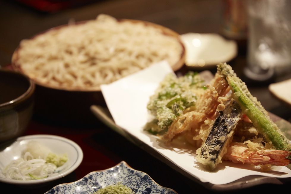freshly made vegetable tempura accompanied by soba noodles