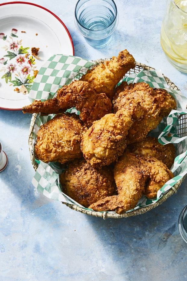 fried chicken in a basket on a table