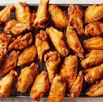 crispy golden brown fried chicken wings on a pan
