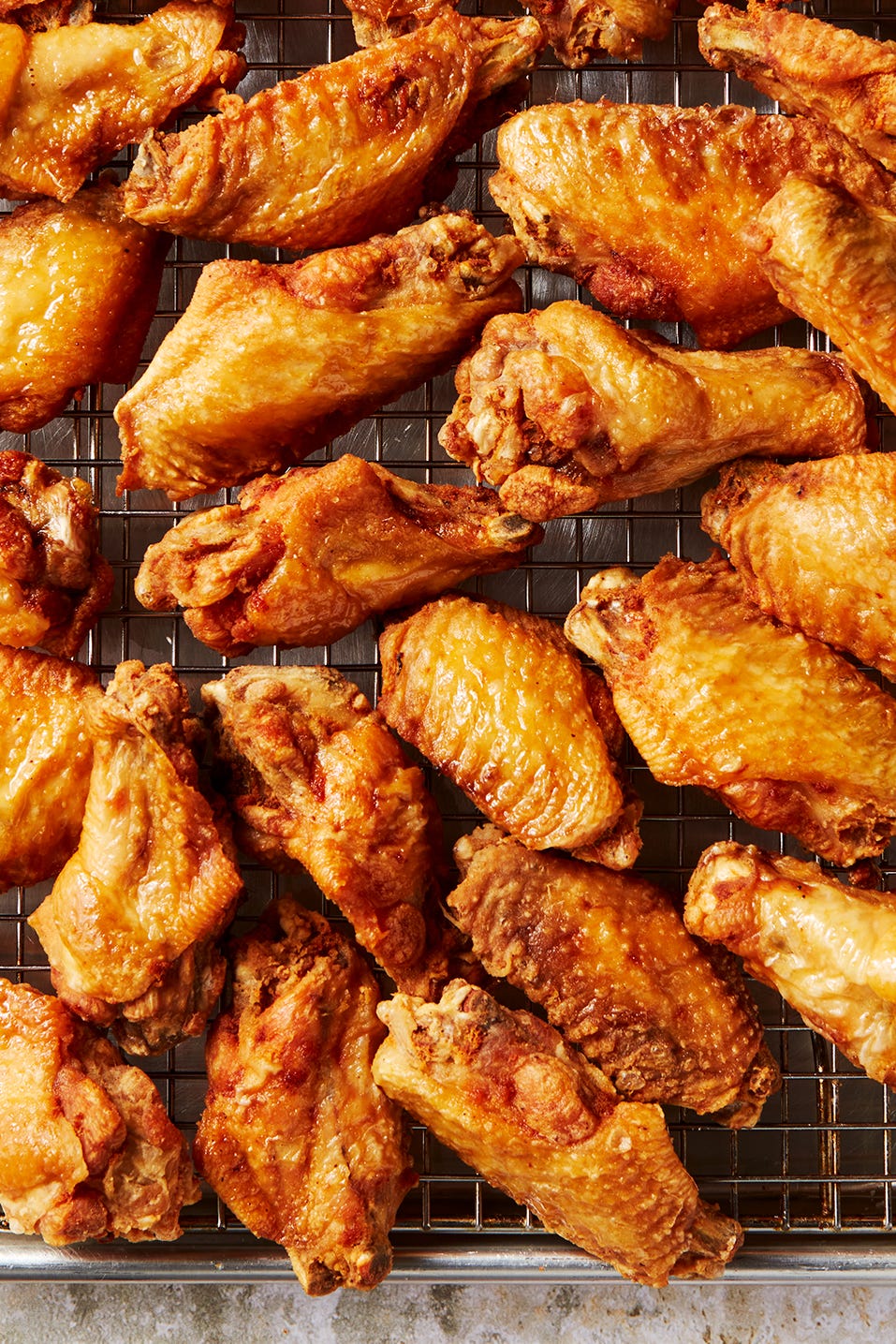 Fried Chicken Wings crispy golden brown fried chicken wings on a pan