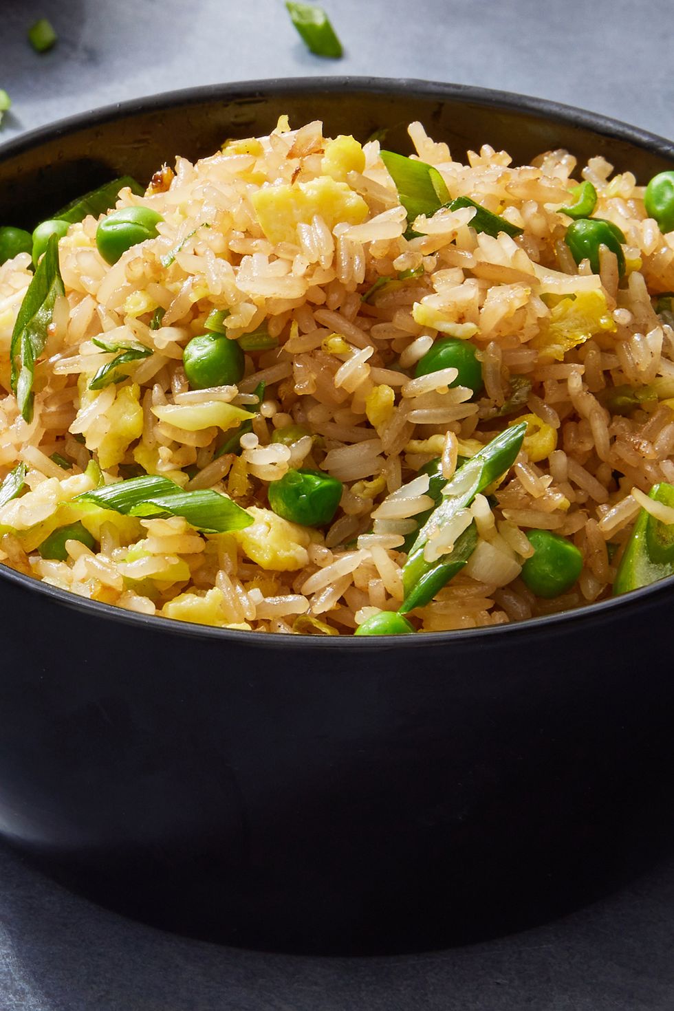 fried rice with peas, eggs, and green onions