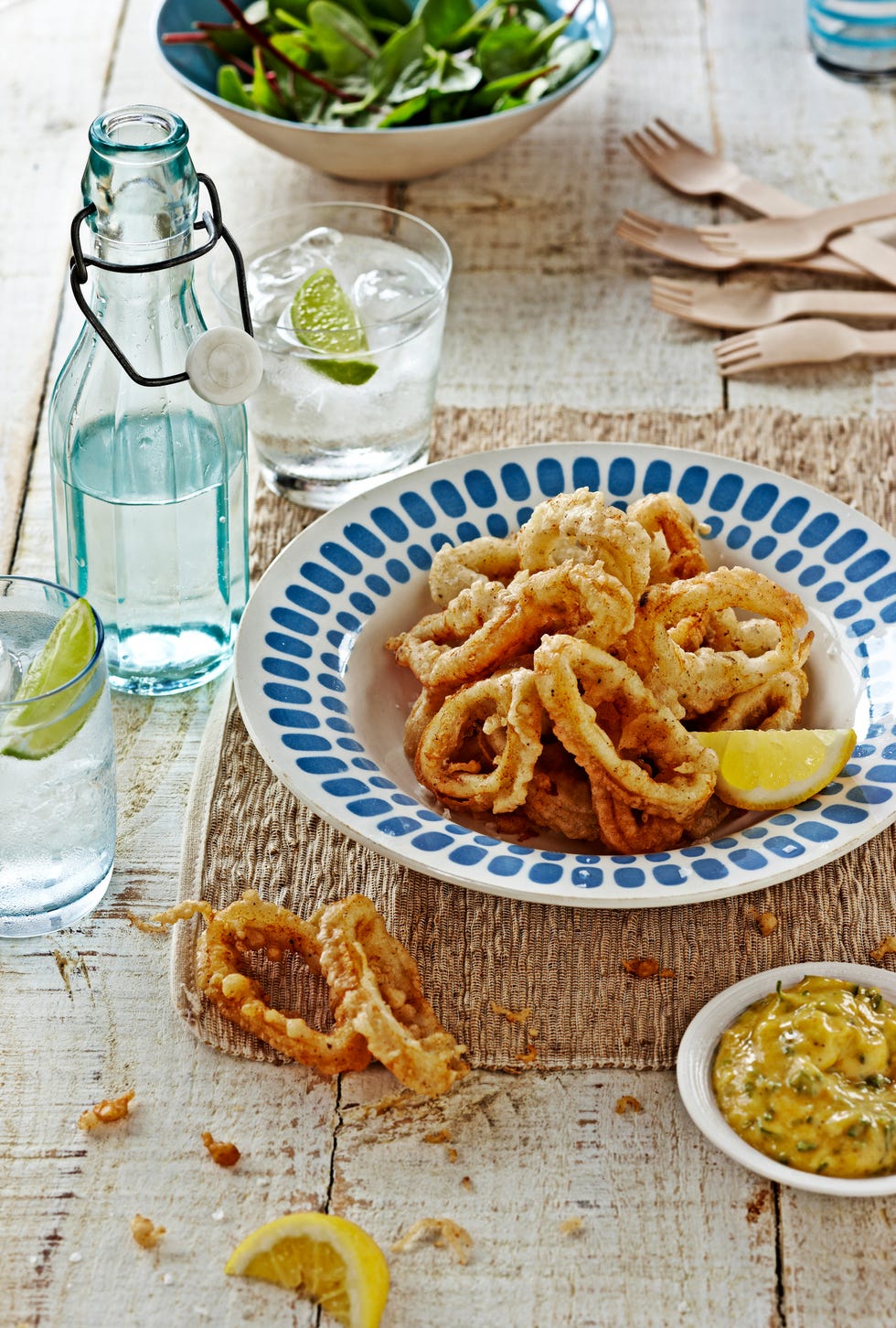 fried squid rings, calamari, on wooden table
