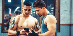 friends after workout a fitness centre posting an image on the social media