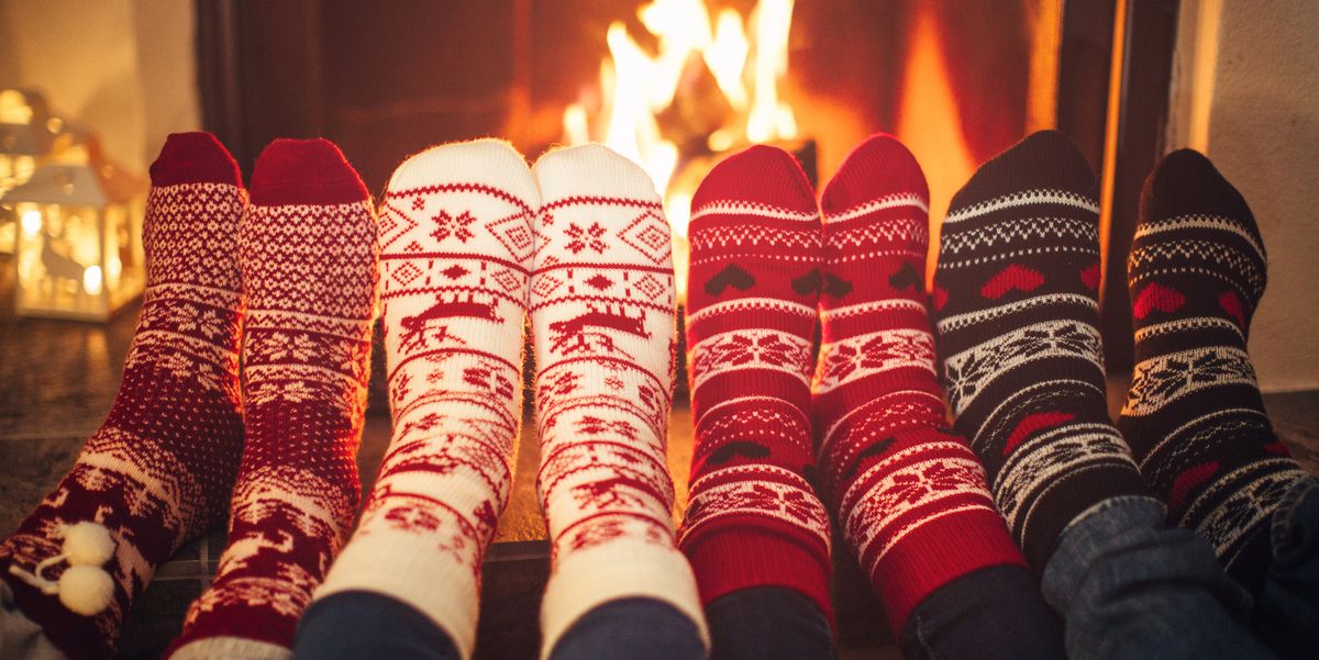 friends at cozy winter vacation in christmas socks