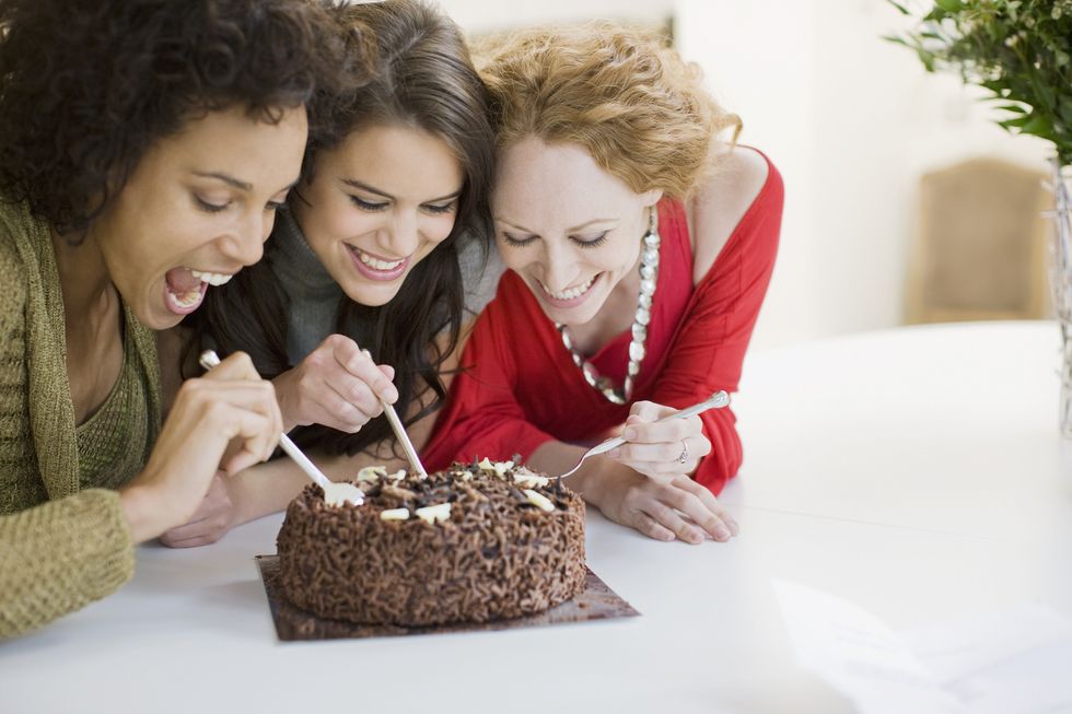 friends eating chocolate cake