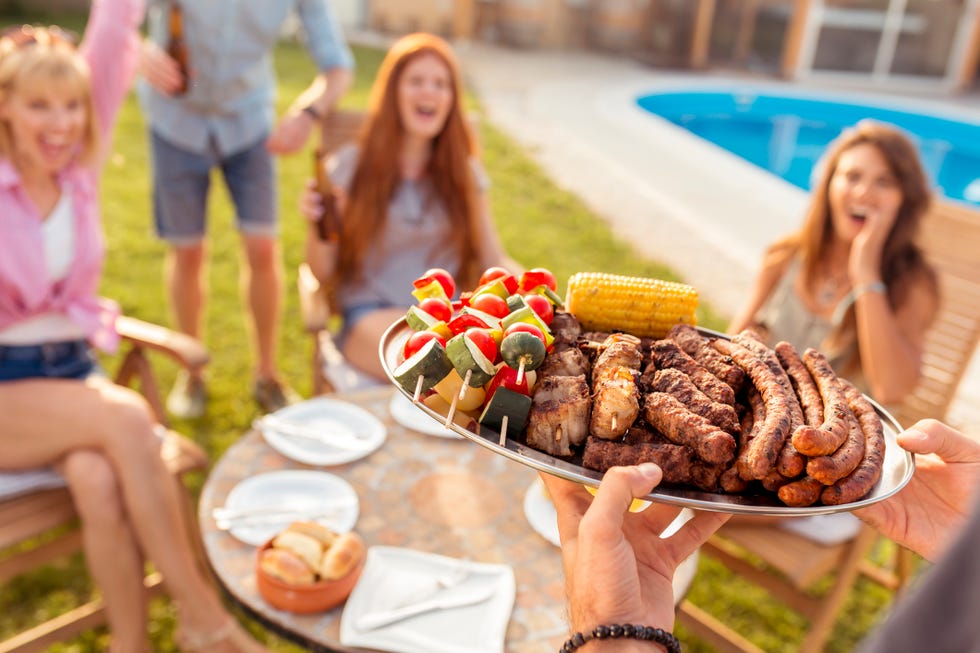 friends having a backyard barbecue party