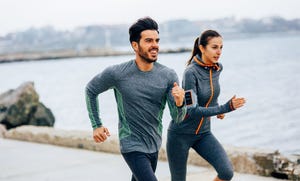 friends jogging by the sea