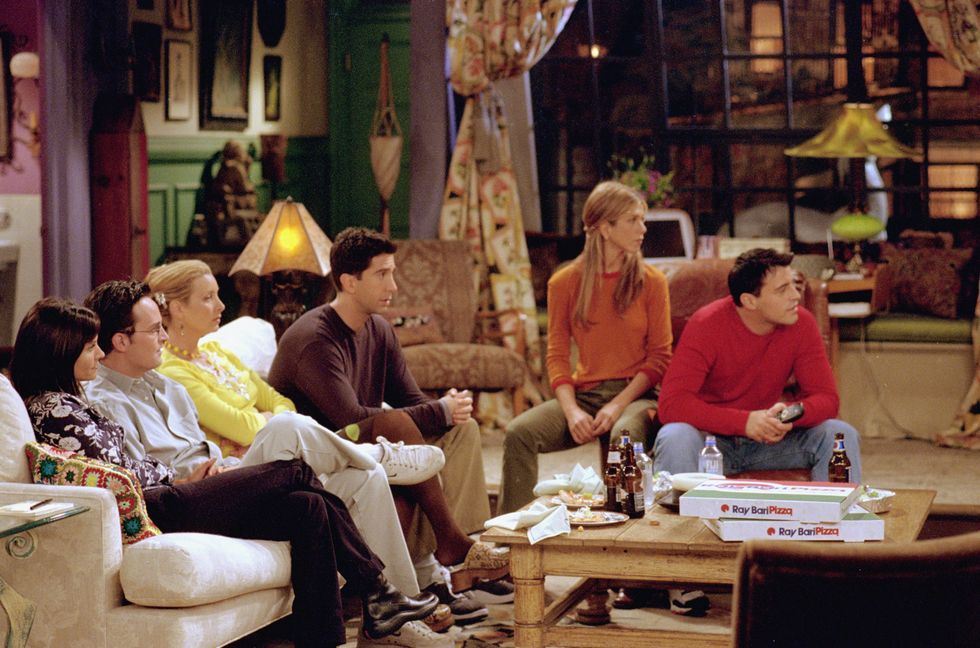 monica, chandler, phoebe, ross, rachel joey in monica's apartment in a still from friends season 7