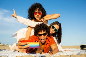 friends taking a selfie with at the beach