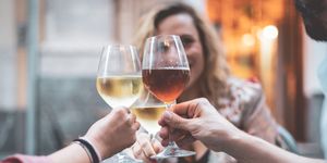 friends toasting wineglasses in restaurant