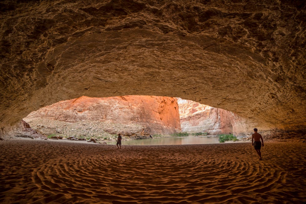 friends walking in red wall cavern