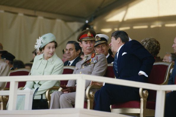 Queen Elizabeth, Grand Duke Jean, and then-President Ronald Reagan sit next to each other during an event commemorating the 40th anniversary of D-Day.