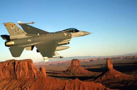 f 16c from luke afb az flies a training mission over monument valley in northern arizona januar