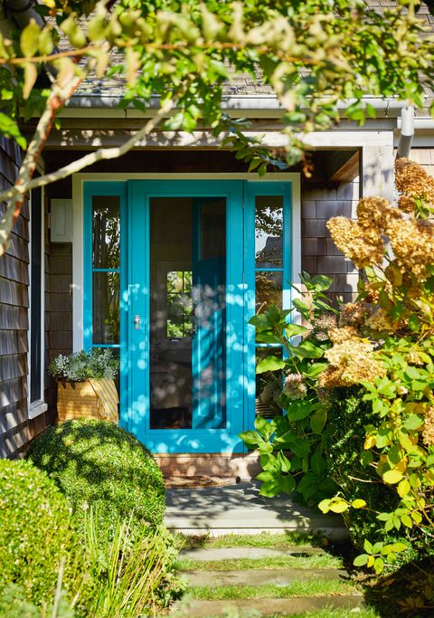 front porch with blue door frame