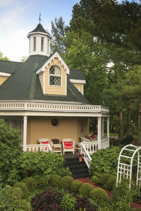 front porch with ice tea and wicker furniture overlooking gardens