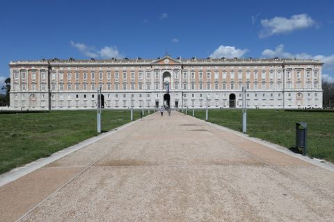 a frontal view of the royal palace of caserta, built by the