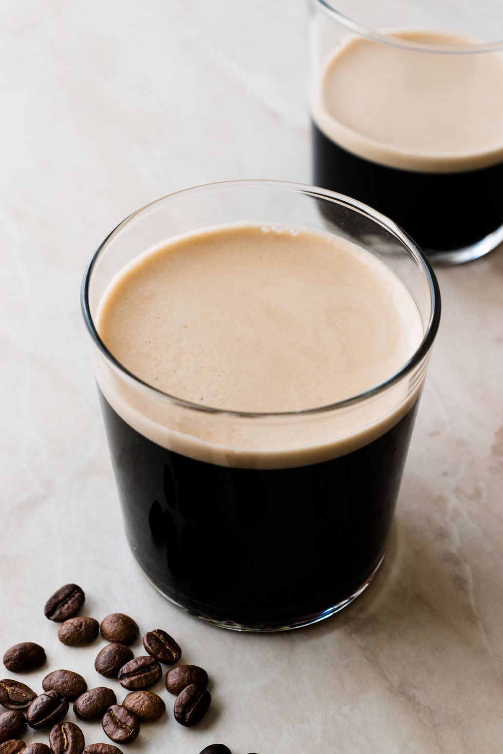 Frothy Cold Brew Nitro Coffee with Beans Ready to Drink.