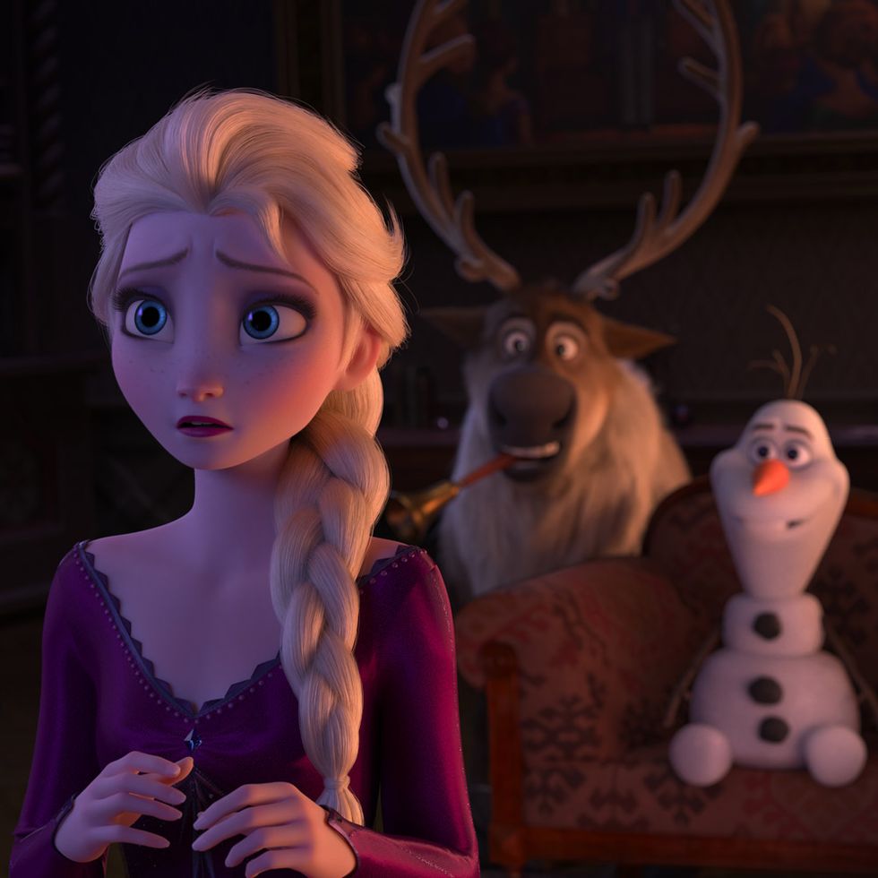 still from frozen 2, showing elsa looking nervous with sven and olaf