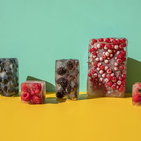 frozen berries on the yellow blue background healthy sweet snacks