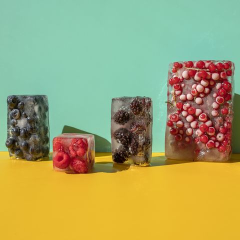 frozen berries on the yellow blue background healthy sweet snacks