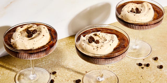 frozen espresso martini with foam and coffee beans on top