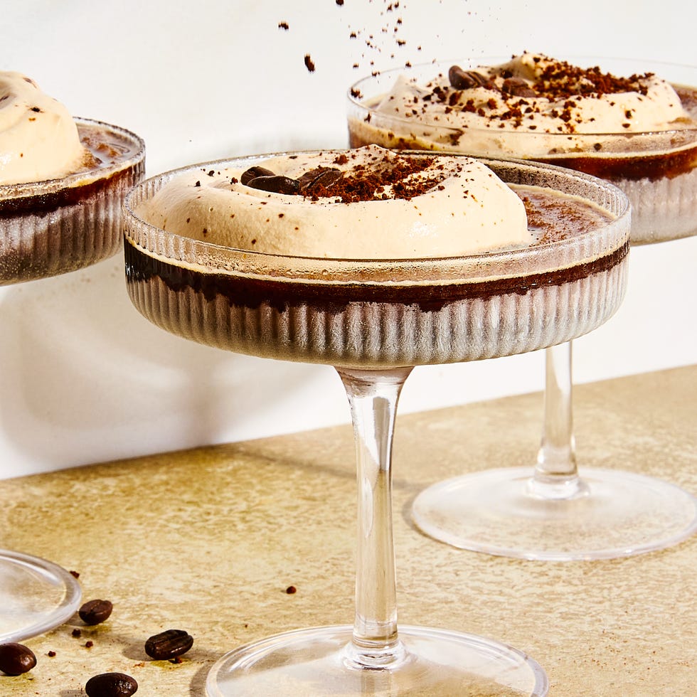 frozen espresso martini with foam and coffee beans on top