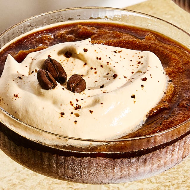 frozen espresso martini with foam and coffee beans on top