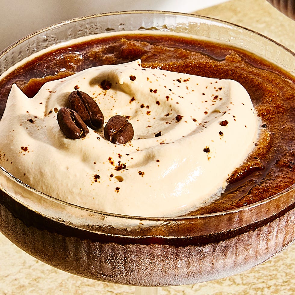 frozen espresso martini with foam and coffee beans on top