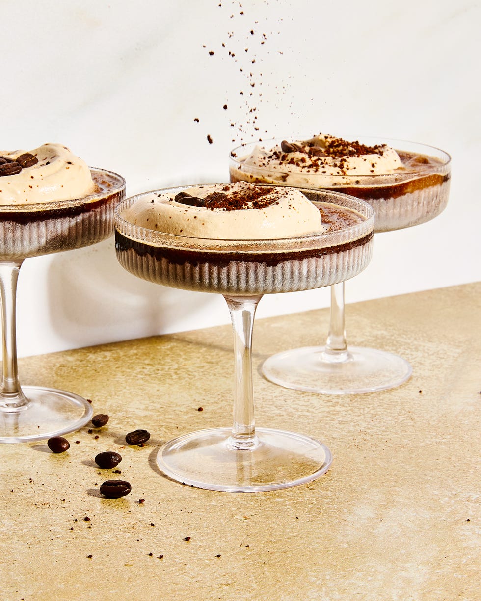 frozen espresso martini with foam and coffee beans on top