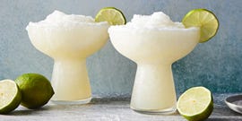 frozen margarita with a salt rim and lime wedge