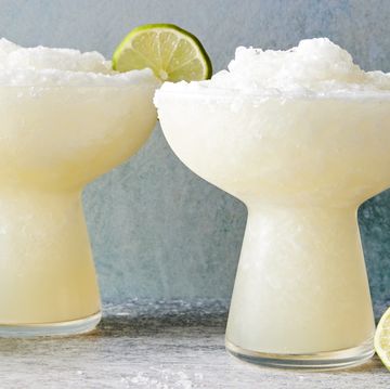 frozen margarita with a salt rim and lime wedge