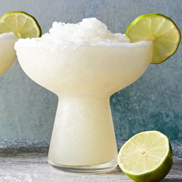 frozen margarita with a salt rim and lime wedge