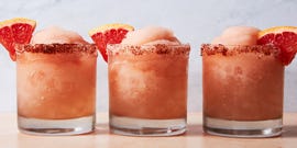 frosty blended pink drink with a grapefruit wedge
