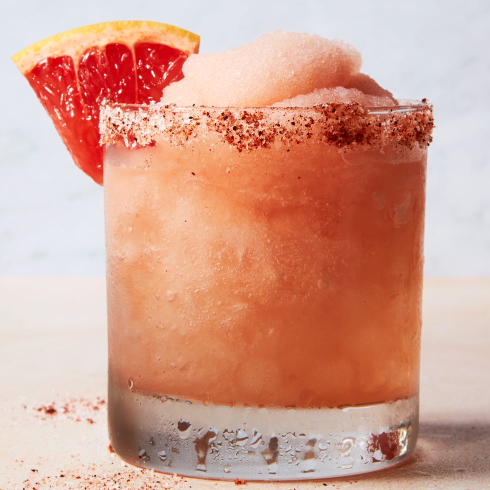 frosty blended pink drink with a grapefruit wedge