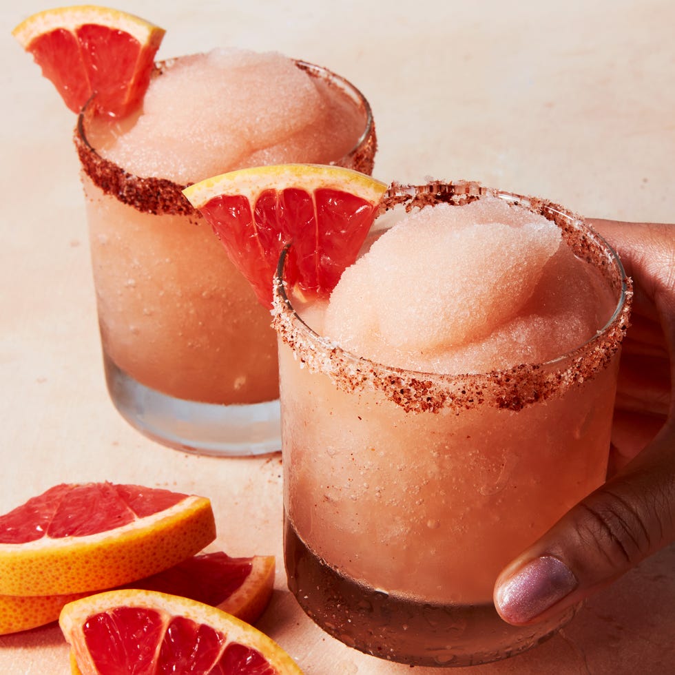 frosty blended pink drink with a grapefruit wedge