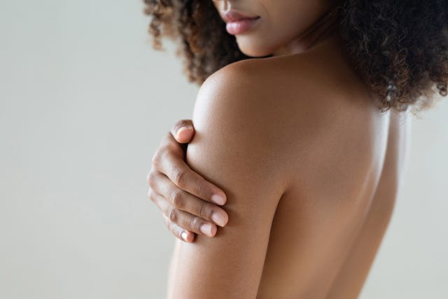 woman with hand on arm