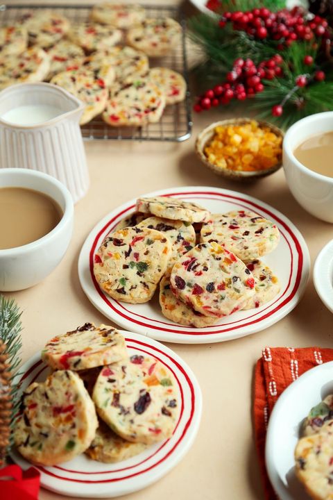 fruit cake shortbread cookies with mugs of coffee and christmas decor