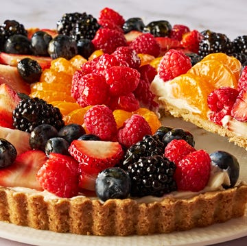 tart topped with blueberries, raspberries, sliced strawberries, blackberries, and orange slices